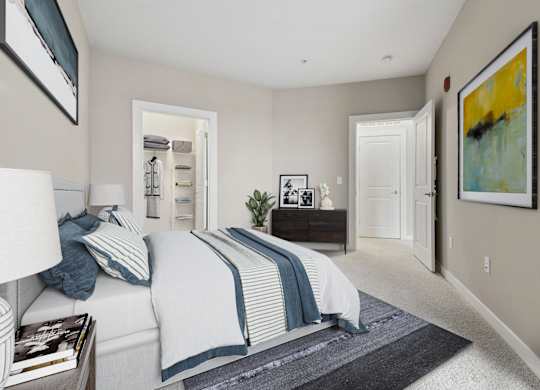 A bedroom with a bed, nightstand, and a painting on the wall.
