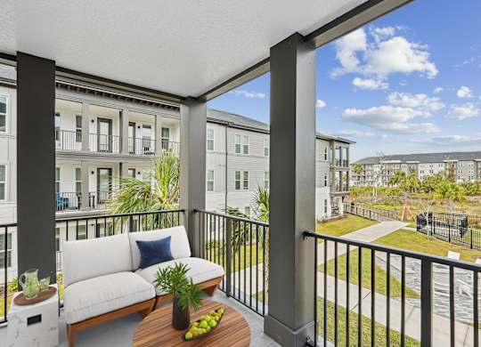 Spacious balcony overlooking amenities at The Crossing at Palm Aire