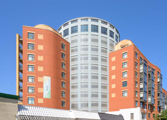 a city building with a blue sky in the background