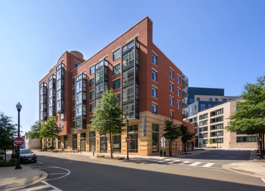 a large brick building on the corner of a city street