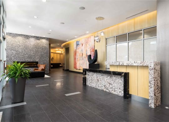 the lobby of a hotel with a reception desk