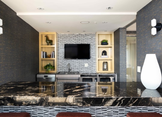 a living room with a table and a television
