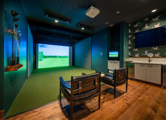 Golf simulator with seating and bar area