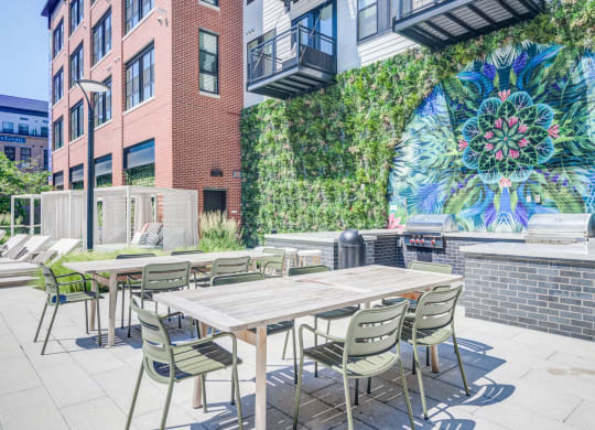 Outdoor grilling station infront of mural