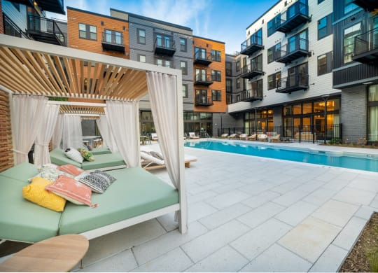 View of pool with lounge chairs