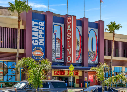 the exterior of a restaurant with large signs on the side of the building