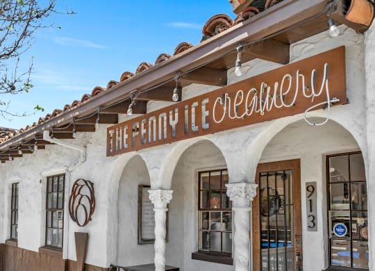 a white building with a sign that reads the holy life collective