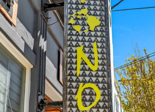 a sign for a pawn shop on the side of a building