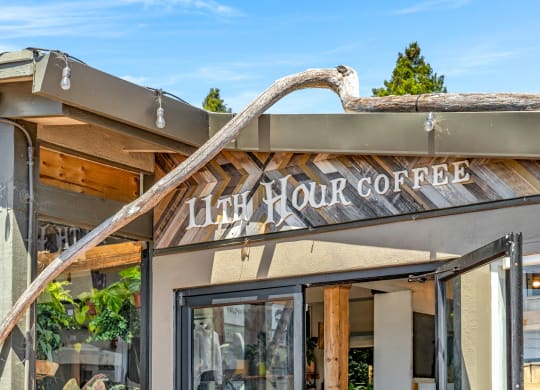 a building with a sign that reads juicy rock coffee