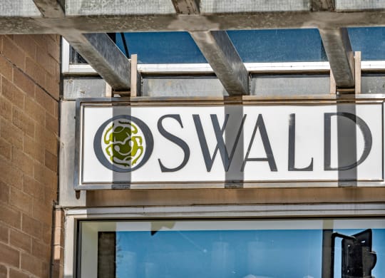 a sign for a swaledale sign on the side of a building