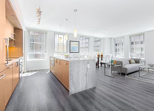 a kitchen and living room in a 555 waverly unit