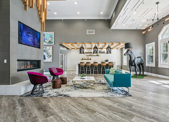 A modern living room with a fireplace and a television.