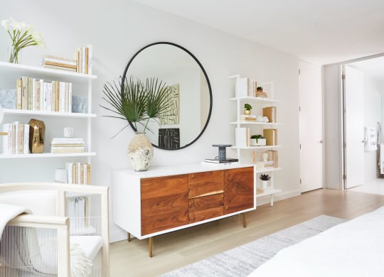 Decorated living room with bookcases and storage