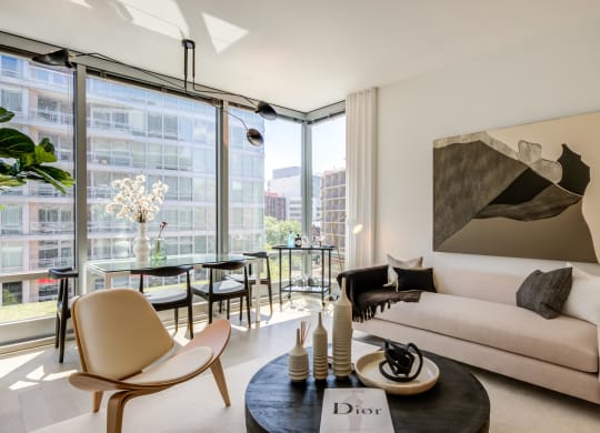 Apartment living room lined with floor-to-ceiling windows