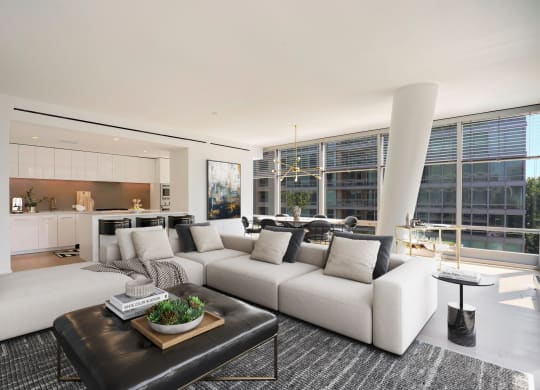 Spacious apartment living room showing kitchen