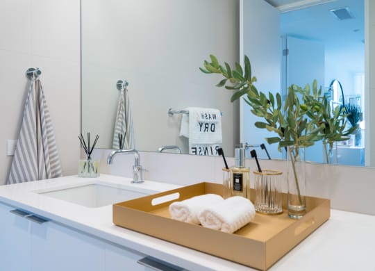a bathroom with a sink and a box with towels on it