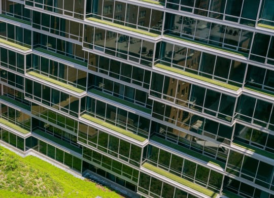 the side of an office building with many windows
