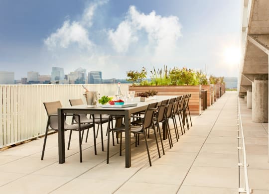 a terrace with a table and chairs on a roof