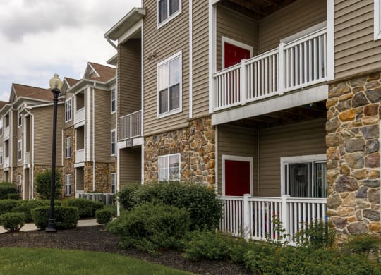 Property Building view with half stone walls and large sectioned windows at Chesapeake Ridge, Maryland