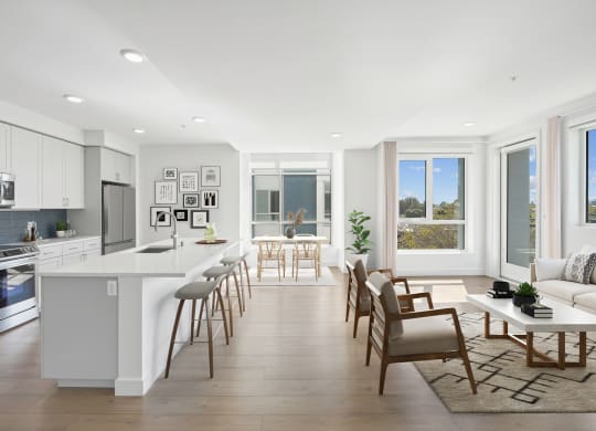 a living room with a kitchen and a dining room