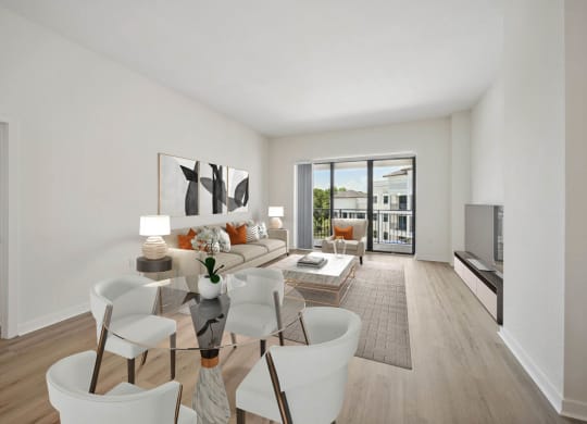 a living room with a couch and a glass table