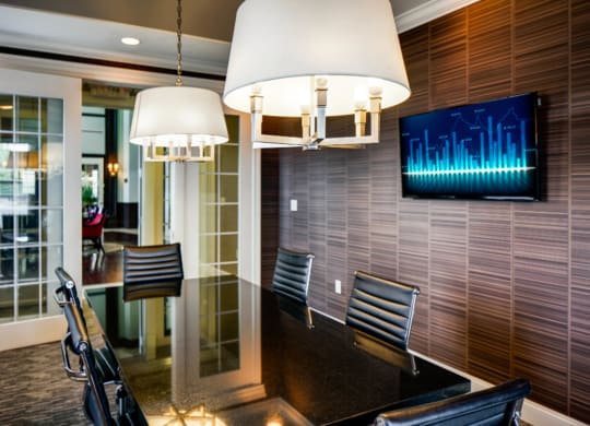 a dining room with a table and chairs and a television