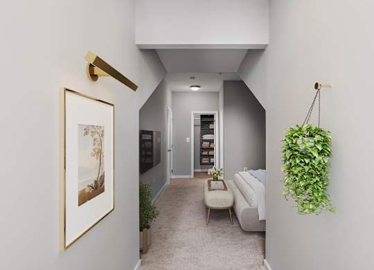 Virtually staged view through an alcove into an upstairs bedroom at Enclave at Emerson, featuring neutral carpeting, a wall-mounted television, a bench and an open closet.
