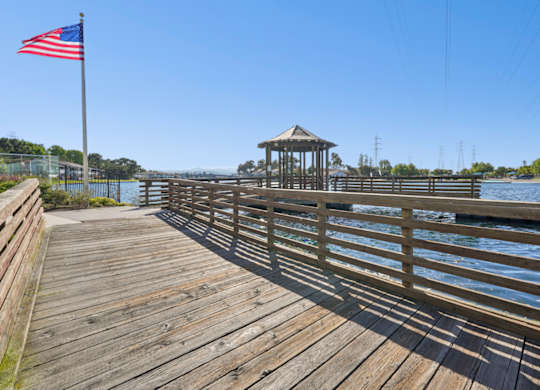 Private dock and waterfront boardwalk at Marlin Cove Apartments in Foster City.