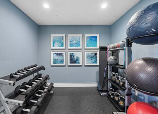 gym with weight machines and strength equipment