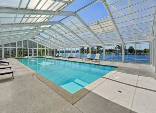 indoor pool house with retractable-style roof panels