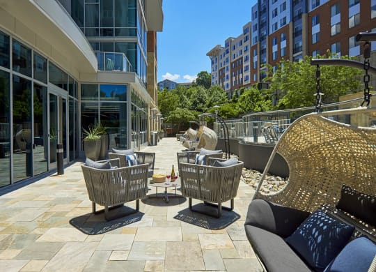 a patio with chairs and tables on a patio