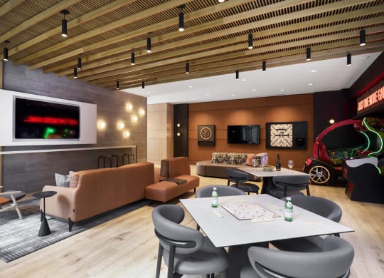 a restaurant or other place to eat in a room with couches and tables