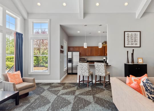 a living room with a kitchen and a dining room