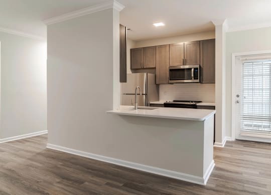 a kitchen with a counter top and a microwave