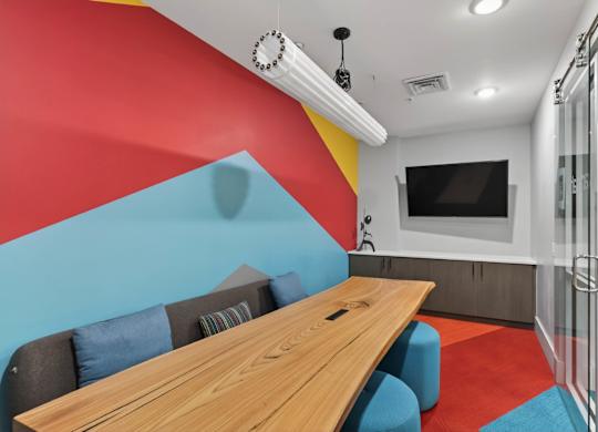 Large conference table in shared clubhouse room.