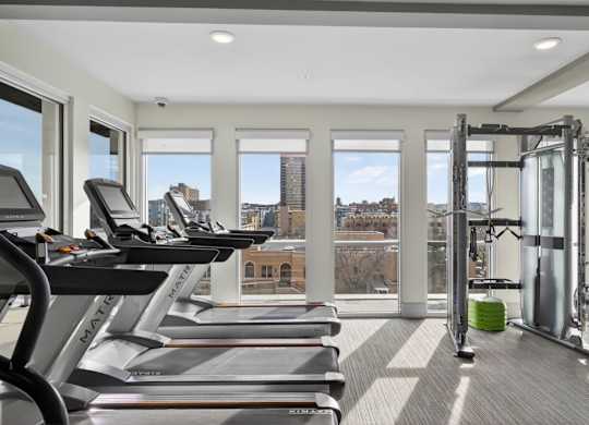 Modern apartment fitness center with cardio and strength equipment in Denver.