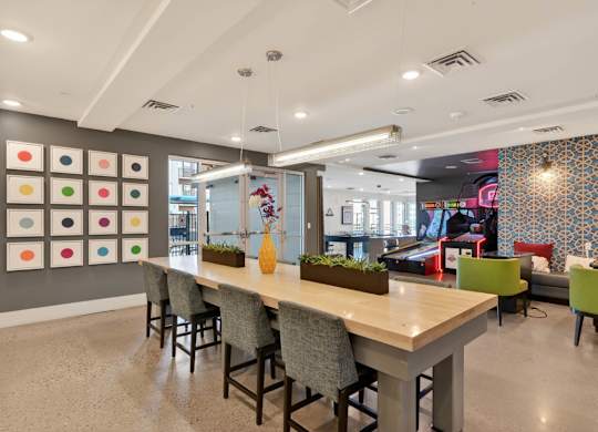 Indoor game room with tables and recreational space.
