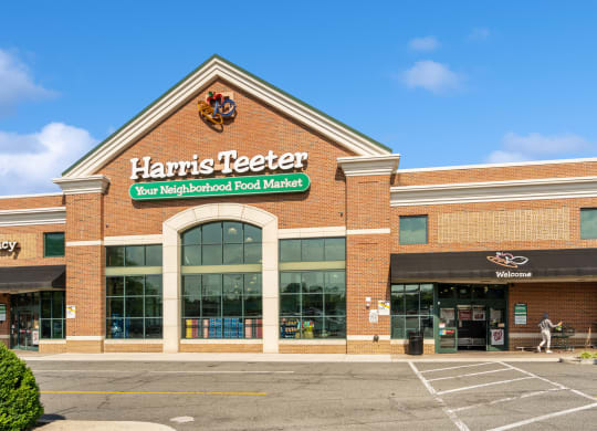 the front of a harris teeter store in a parking lot