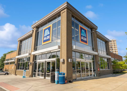 the front of a building with two signs on the side of it