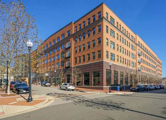 a large brick building on the corner of a city street