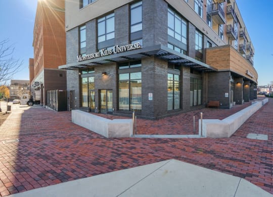 a building with a brick sidewalk in front of it