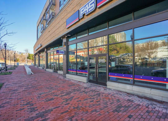 the facade of a store on a brick sidewalk