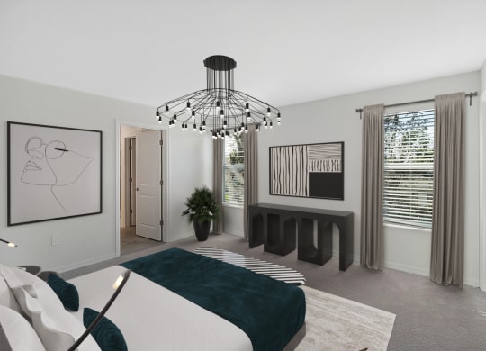 a bedroom with a large bed and a large chandelier