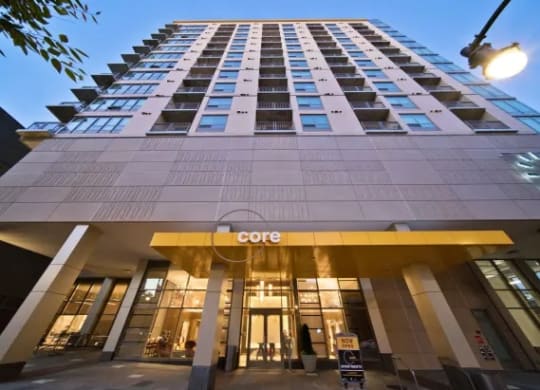 a view of the facade of a tall building with a lobby