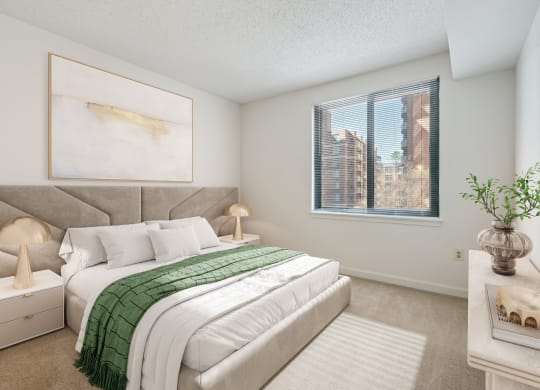 a bedroom with a large bed and a window