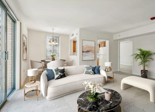 a living room with a white couch and a round table