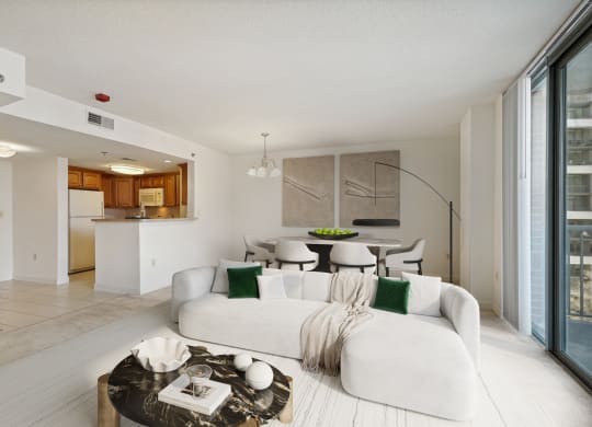 a living room with a white couch and a table