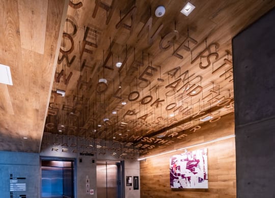 the lobby of a building with a circular design on the floor