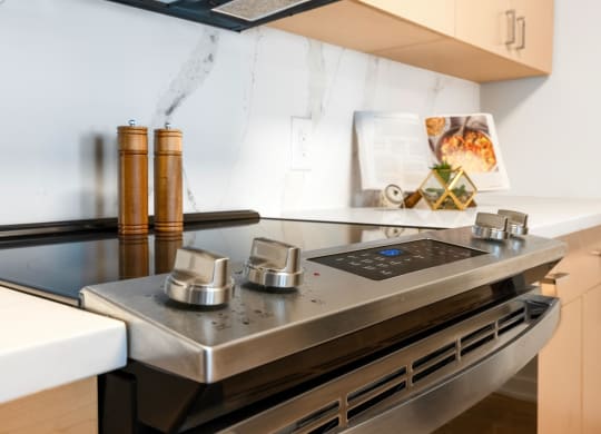 a kitchen with a stove and a sink
