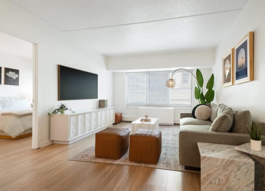 a living room with a couch and a table and a television